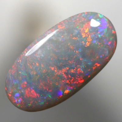 SOLID SEMI BLACK OPAL Sparkles of fire red and green over mauve